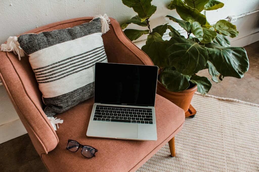Laptop sitting on a comfy chair in a therapist's office